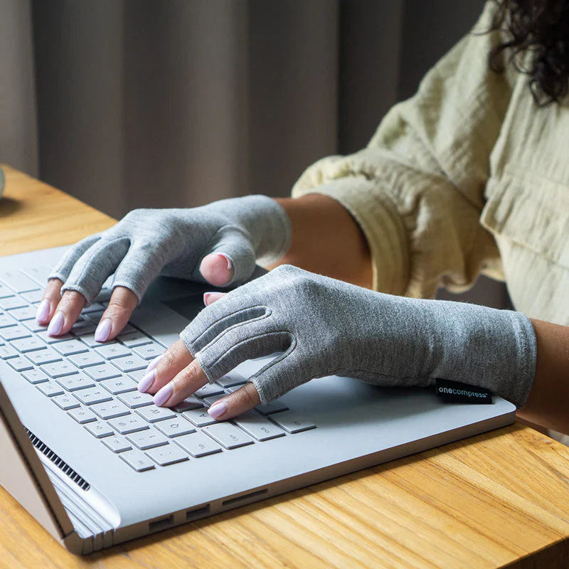 OneCompress™ Compression Gloves worn on hand